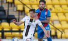 Caley Thistle forward George Oakley, right, challenges Livingston's Jack Fitzwater.