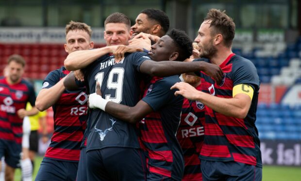 Ross County's Jordy Hiwula celebrates his winner with his team-mates.