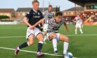 Queen's Park's Grant Savoury in action against Dundee's Max Anderson in the Dark Blues' recent 2-1 Premier Sports Cup win.