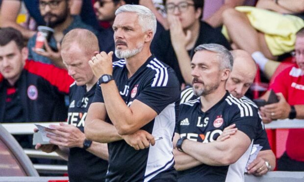 Aberdeen manager Jim Goodwin watches the action in the 5-0 defeat of Stirling Albion.