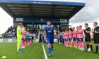 Mitch Megginson leads Cove out for their Championship opener against Raith Rovers.