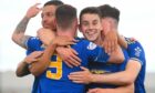 Cove's Mitch Megginson celebrates (9) with his team mates as he makes it 1-0 against Raith Rovers.