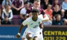 Owura Edwards in action for Ross County against Hearts.