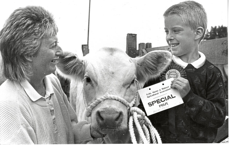 A mother and her son with their prize-winning calf at the Echt show.