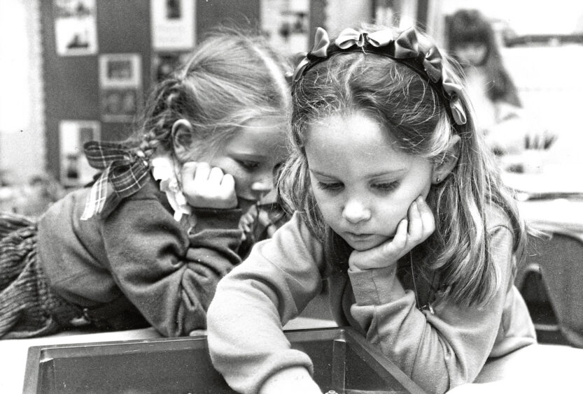 Sally Martin and Jayme Morris, both 5, in the kindergarden class at Aberdeen's American school in February 1992