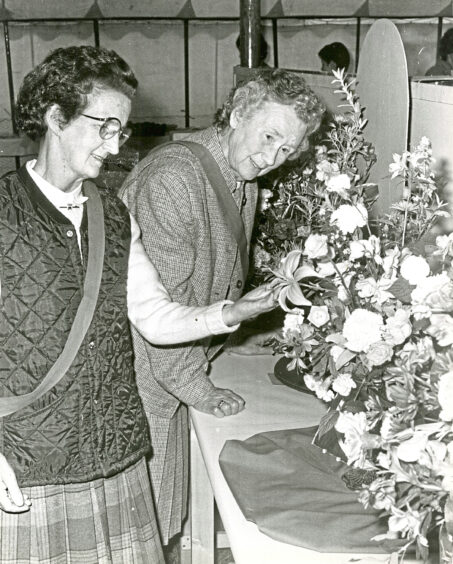 Two women with their floral displays at the show