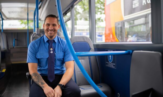 Stagecoach driver, one of many PCV driver jobs in Scotland, sits in a bus.