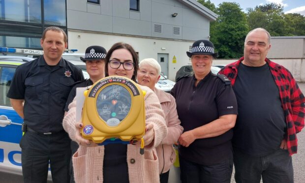 The Garrow family from Nairn have donated five defibrillators to their local police station in memory of Alex Garrow who died in February last year.