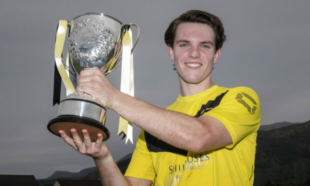 Fort William star Arran MacPhee with the 2019 Balliemore Cup won against Glasgow Mid Argyll at An Aird, Fort William.
