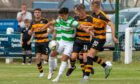 Buckie Thistle's Max Barry tries to hold off a couple of Alloa defenders