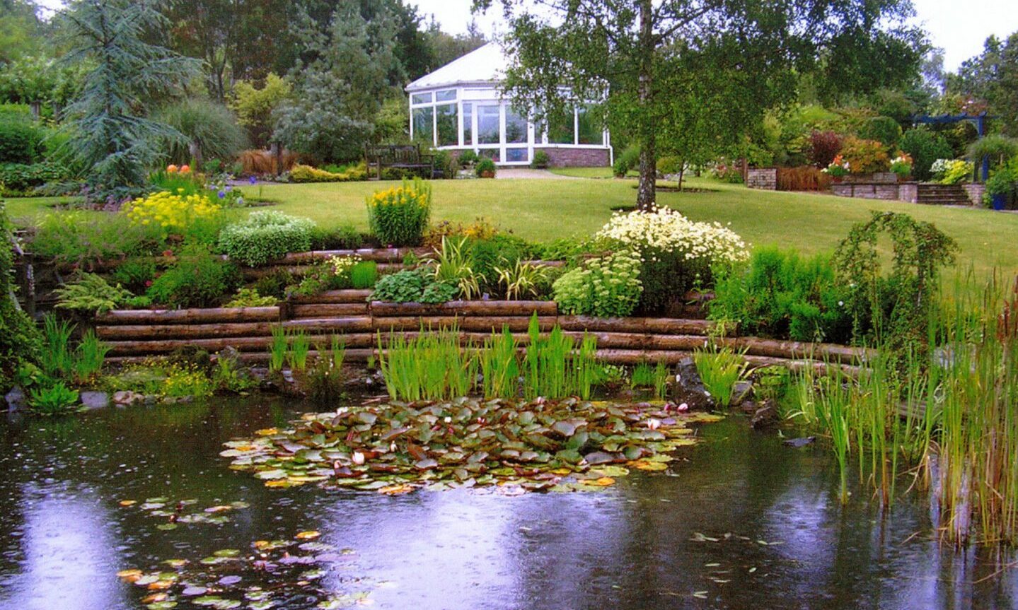 The main pond at Beechgrove and the conservatory.