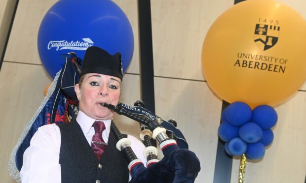 Piper Julie Brinklow kept the music flowing during day two of Aberdeen University's graduations at P&J Live. Pic: Chris Sumner/DC Thomson