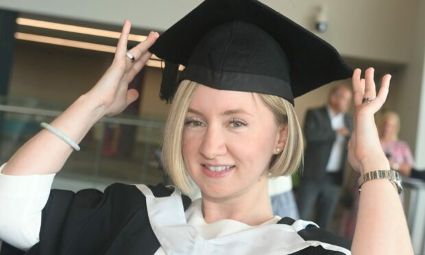 Mandy Vincent-Mitchell is pictured fixing her cap on graduation day. All pictured by Chris Sumner/ DC Thomson.
