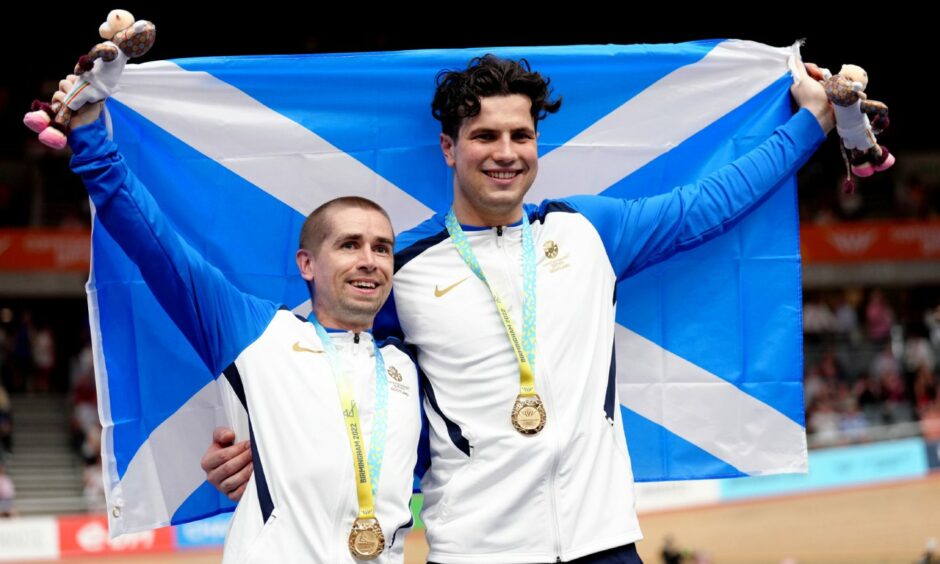 Scotland's Neil Fachie, left, and pilot Lewis Stewart celebrate with their gold medals after victory in the MPhoto by John Walton/PA Wire