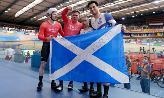 Neil Fachie and Lewis Stewart, right, with tandem sprint victors James Ball and Matt Rotherham. Lewis Stewart and Neil Fachie congratulate victorious pair Matt Rotherham and James Ball. Photo by John Walton/PA Wire