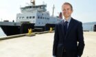 CalMac chief executive Robbie Drummond in front of a CalMac boat.