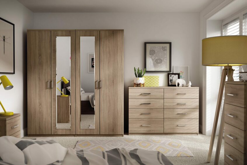 a closet and chests of drawers provide plenty of storage space in a bedroom
