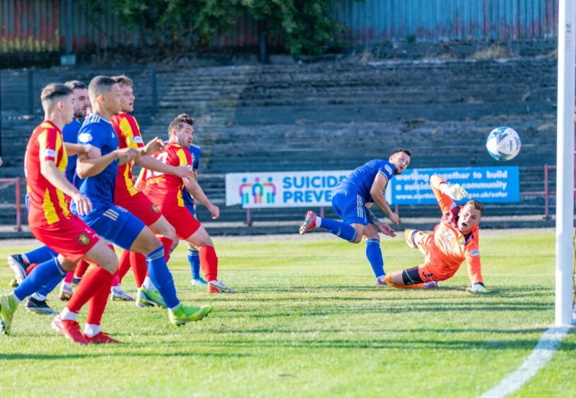 Cove's Connor Scully heads across the goal during the Premier Sports Cup between Albion Rovers and Cove Rangers