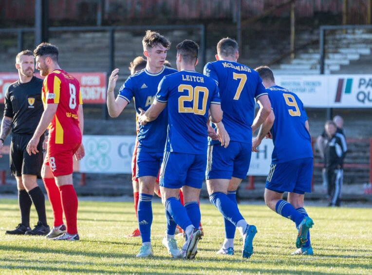 Cove Rangers players celebrate with Robbie Leitch after he equalises against Albion Rovers in a Premier Sports Cup tie at Cliftonhill. Photos by Dave Cowe