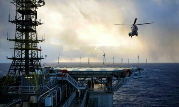 A montage of an oil rig, a helicopter and an offshore wind farm