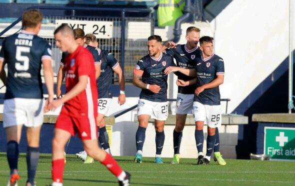 Raith Rovers players congratulate Dylan Easton after his second goal against Peterhead
