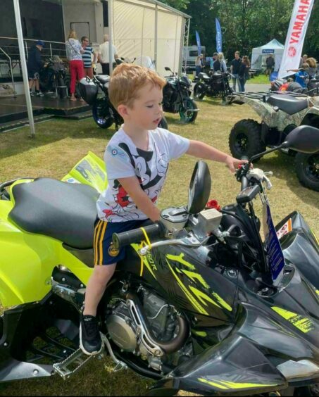 Miller having fun on a bike when they entered the Royal Highland Show.