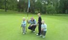 Dad Stuart with the young Connor, Gregor and Archie on the Wee Course at Blairgowrie.