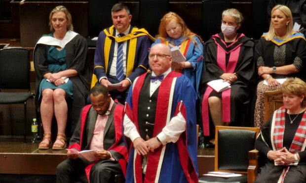 Bob Keiller receives his honorary doctorate.