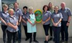 Kirktown Garden Centre staff with the new defibrillator.