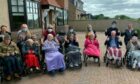 Residents and their relatives, plus members of staff from Bayview Care Home setting off on the sponsored walk.