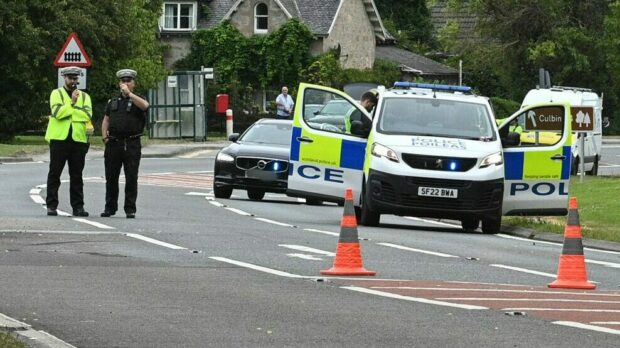 Police at the scene of a crash on the A96 in Brodie in July 2022. Photo: Jason Hedges/DC Thomson