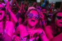 Belladrum music festival in the Highlands is about to get underway. Pictured is a woman in glasses enjoying the music at night.