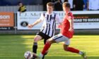 Fraserburgh's Connor Grant, left, tries to get the better of Montrose's Blair Lyons