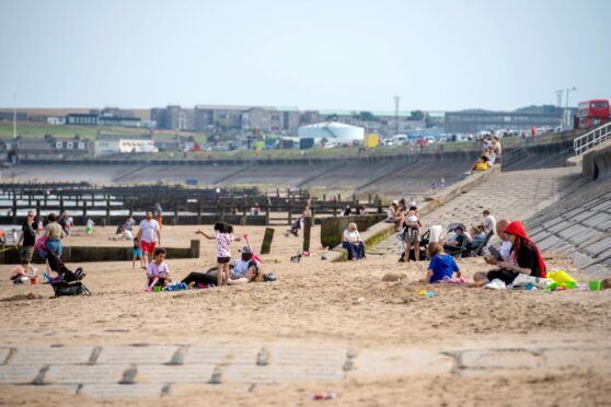 Crowds gathered on Aberdeen beach to enjoy the good weather while it lasts. Picture by Kath Flannery.