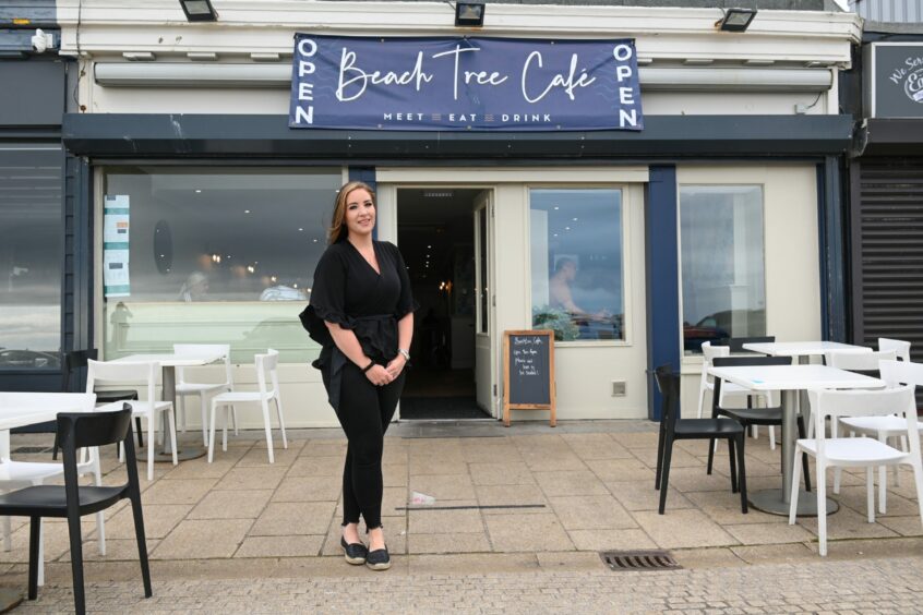 Michelle standing outside Beach Tree Cafe Aberdeen