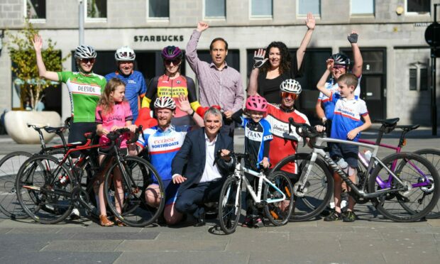 TotalEnergies MD Jean-luc Guiziou and councillors Martin Greig, and Jessica Mennie with cyclists from local groups at today's launch. Picture by Kami Thomson / DC Thomson.