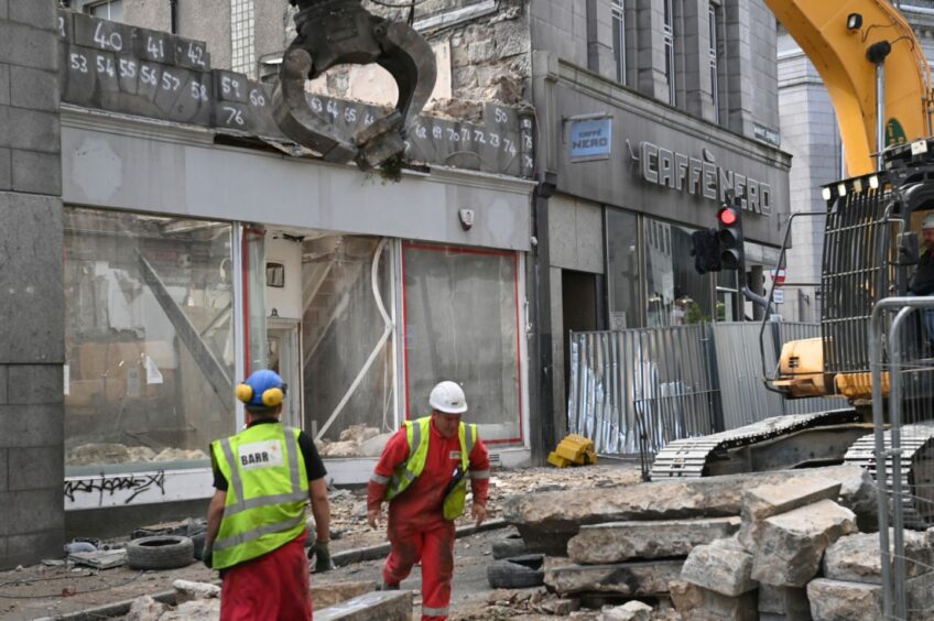 Workers demolishing the former BHS premises on Union Street as part of the £50m new market projects. Picture by Kami Thomson/DCT Media.
