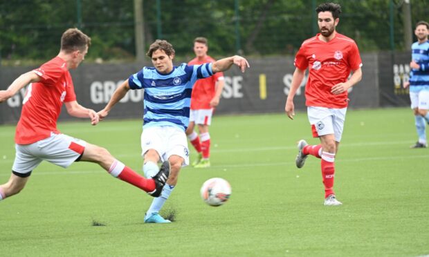 Magnus Watson, centre, has a shot for Banks o' Dee against Nairn County