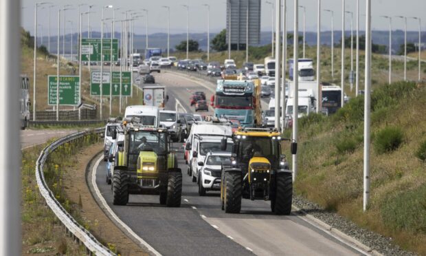 Two tractors took part in the fuel price protest on the A92 Stonehaven to Aberdeen road today.  Pic: Newsline Media