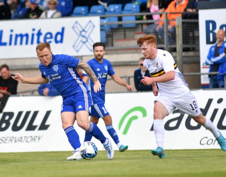 Conor O'Keefe, left, in action for Peterhead