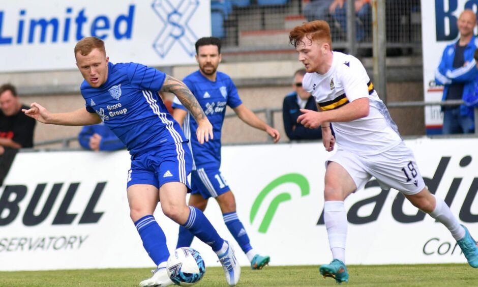 Conor O'Keefe, left, in action for Peterhead