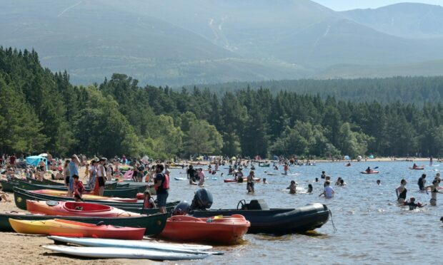 Loch Morlich near Aviemore is packed with sun seekers. Photo by Sandy McCook/DC Thomson