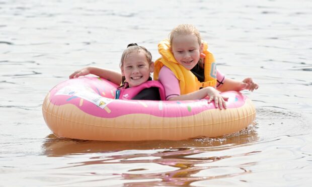 Making the most of the water, eight-year-old Lena Fox (right) and Maja Kuligowska, 10, both of Inverness.