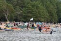 Loch Morlich was packed with people enjoying the summer sun on Tuesday. Picture by Sandy McCook.