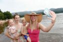 Another hot day in Strathspey and Aviemore with people making the most of the beach and water at Loch Morlich. (L-R) Olivia Ferrier (14mths) with her mum Amie , Zac Burns (3) with his mum Hannah enjoy the waters of Loch Morlich. Sandy McCook/DCT Media