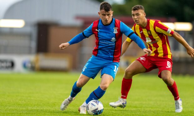 Aaron Doran on the attack for Caley Thistle against Albion Rovers.
