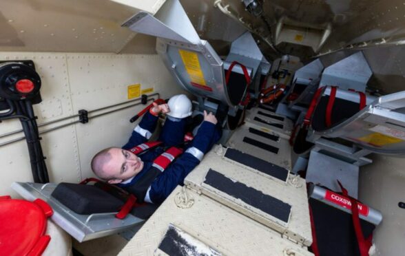 Reporter Ryan Duff tries free fall lifeboat simulator.