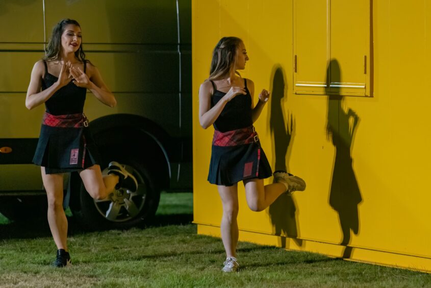 Red Hot Chilli Pipers dancers have a little practice session with their shadows. Picture by Jasperimage.