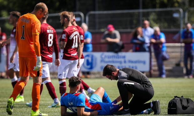 ICT defender Max Ram received treatment on the pitch before being taken off with a thigh injury against Kelty Hearts on Saturday.