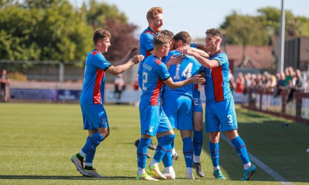 Caley Thistle's players celebrate George Oakley's late winner at Kelty. Picture - Steven Brown